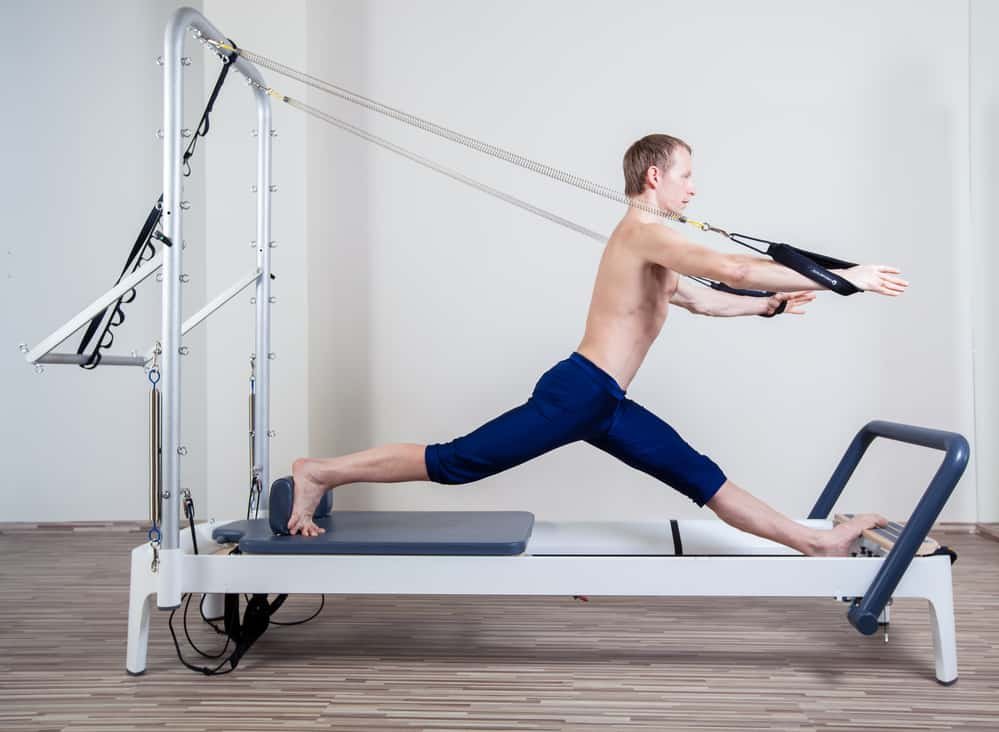 Learn How To Gain Muscle Fast With These Winning Tactics 4 Pilates reformer workout exercises man at gym indoor