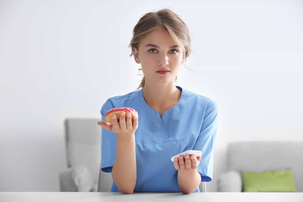 Female doctor with donut