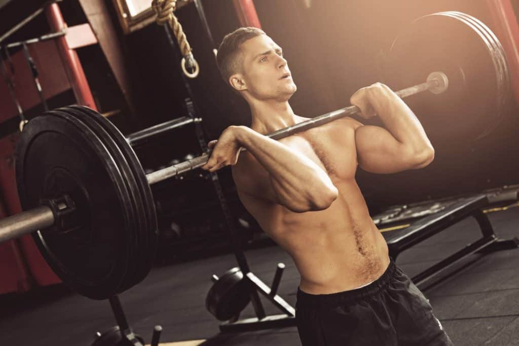Muscular man during his weightlifting workout in the gym