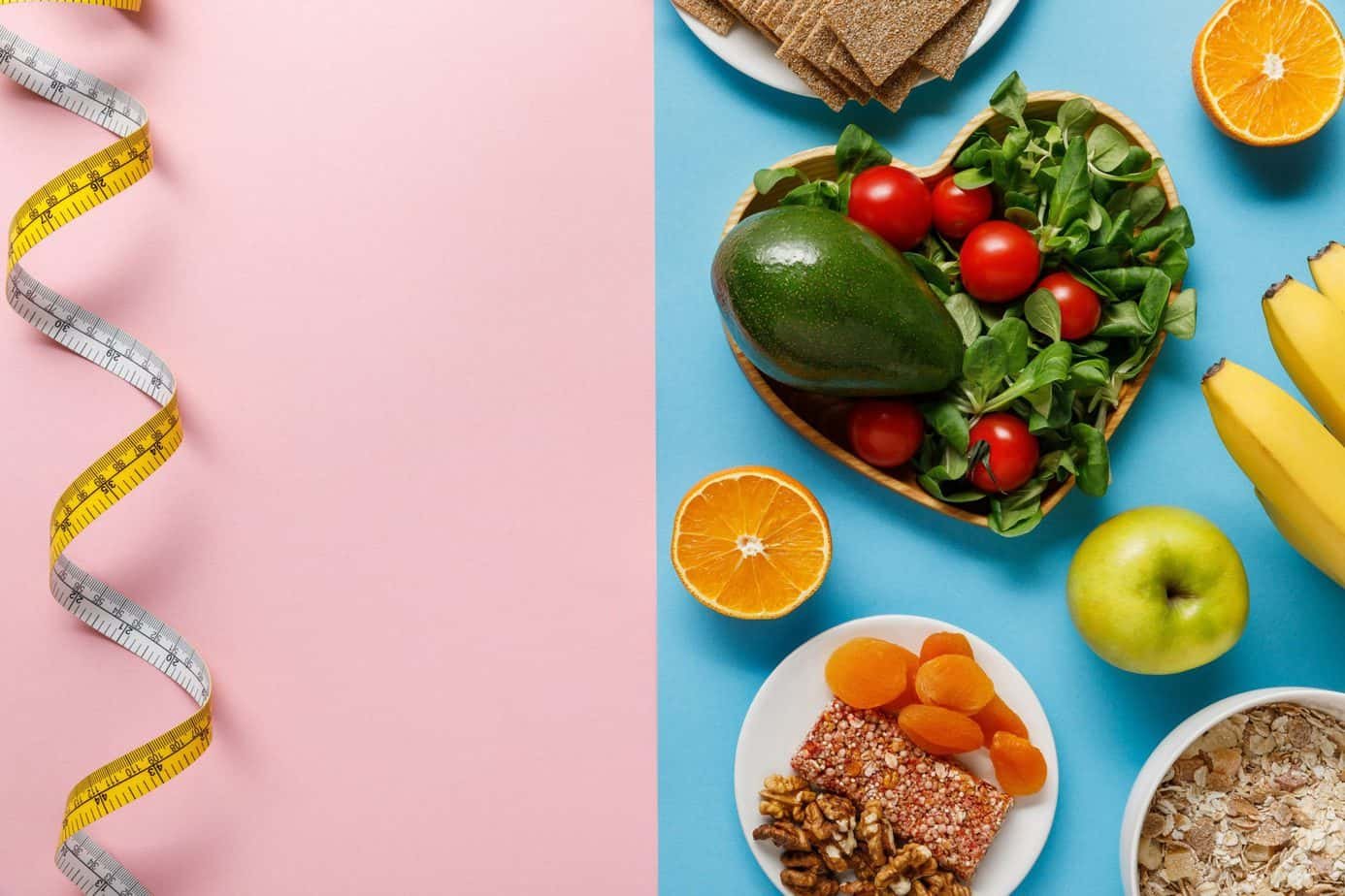 Why Diets Don't Always Work 1 Top view of diet food on blue and measuring tape on pink background