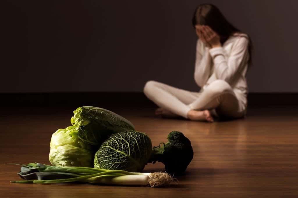 Woman suffering from eating disorder