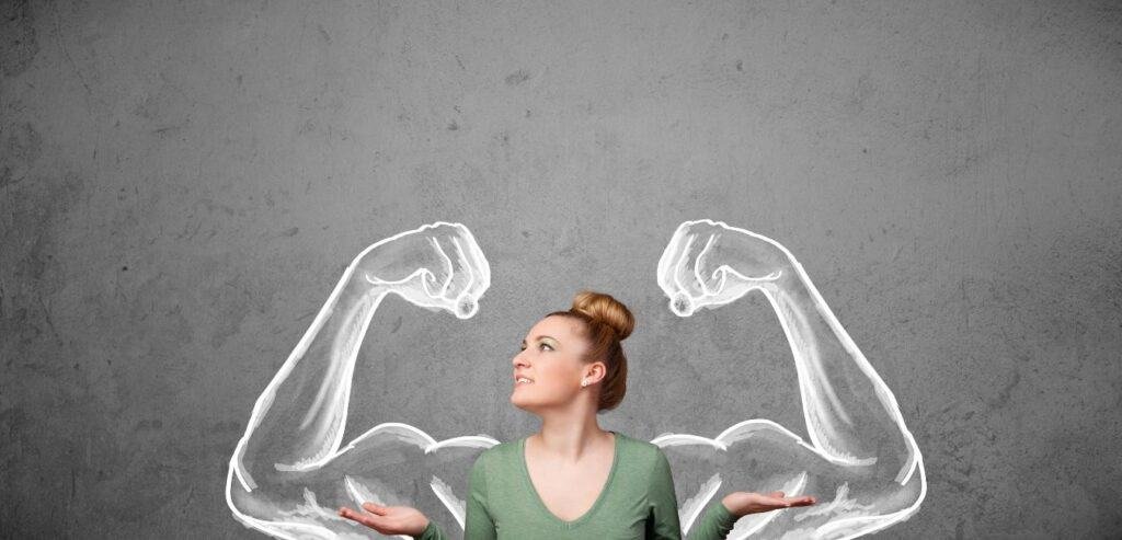 Young woman with strong muscled arms