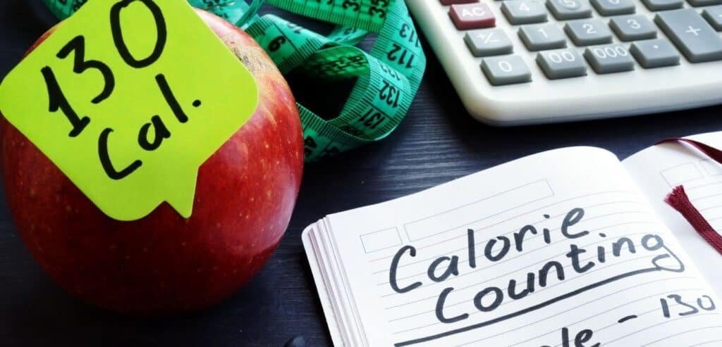 Calorie count concept. Apple and among calories.