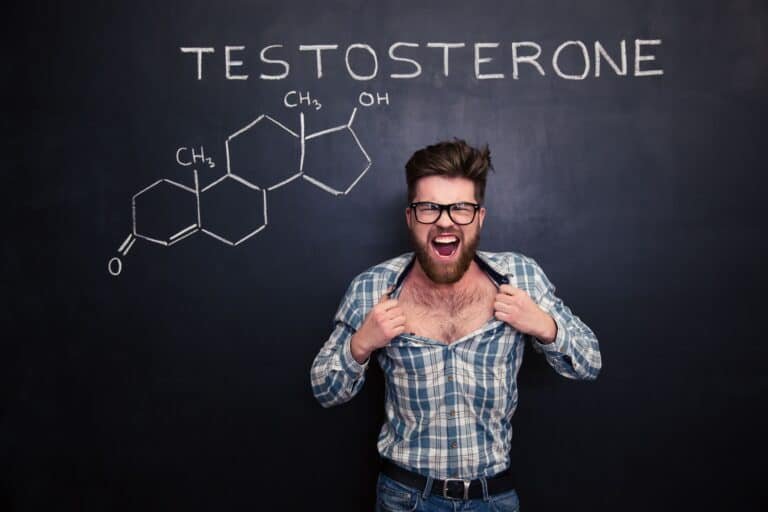 Aggressive man in glasses screaming and tearing off his shirt