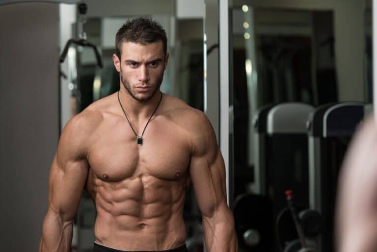 Healthy Young Man Doing Exercise For Biceps