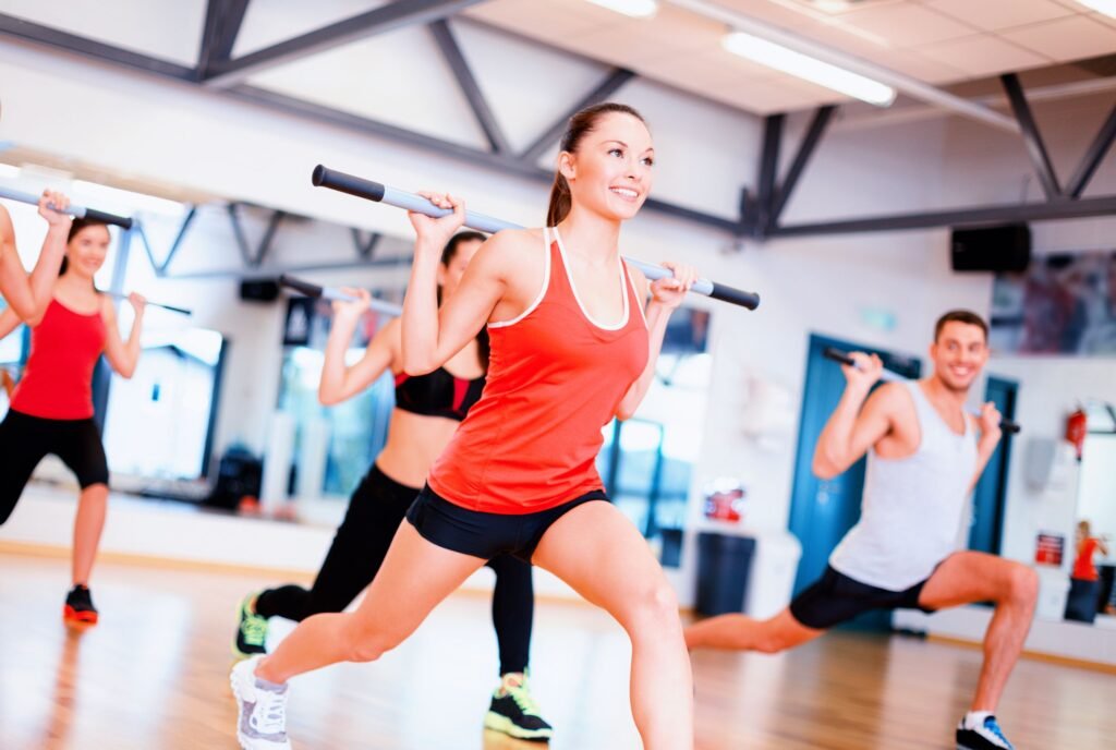 How To Select The Right Workout Plans 3 Group of smiling people working out with barbells