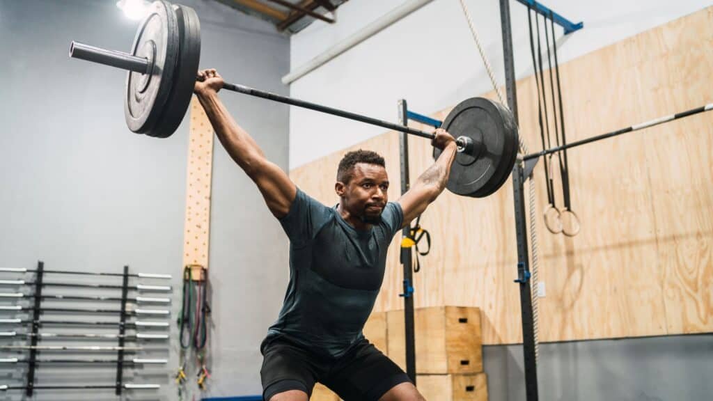 The Best Crossfit Workouts for Weight Loss: Get Fit and Shed Pounds 4 Crossfit Athlete Lifting a Barbell
