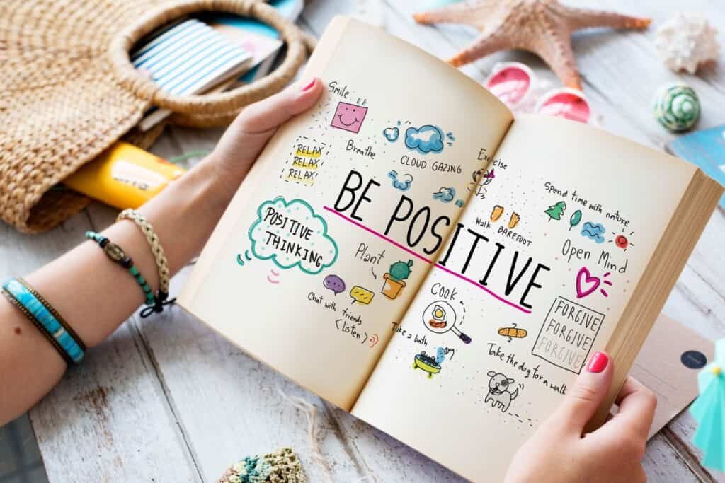 From Negative to Positive: Discover the 10 Benefits of Positive Thinking 5 Woman hands with diary