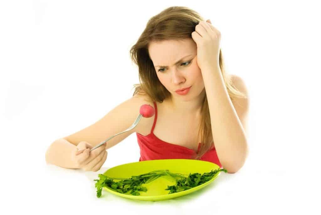 How To Deal With Hunger When Dieting-Science-Based Tips 2 Young woman keeping a diet