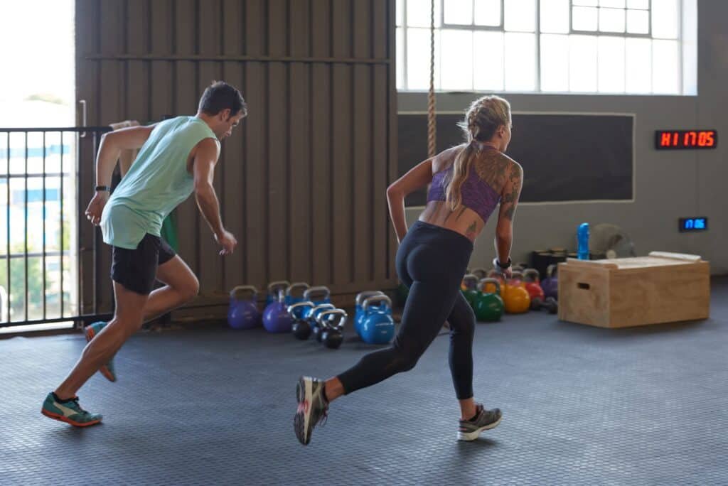The Incredible Benefits Of Circuit Training For Weight Loss Explained 2 Sportive couple sprinting in gym