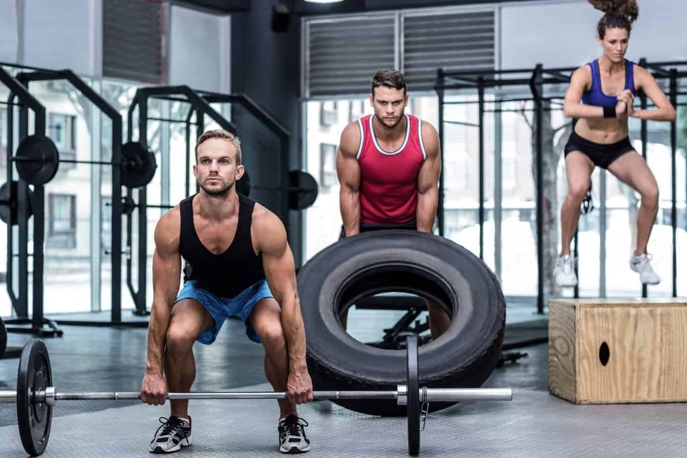 The Benefits of CrossFit: Unlocking Optimal Fitness and Health 1 Benefits of CrossFit:Athletes lifting and jumping