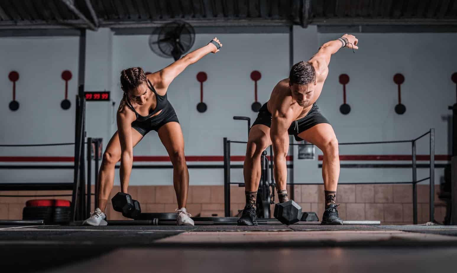 Metabolism Boosters: Unleashing the Power of Anaerobic Exercises for Weight Loss 1 A closeup shot of an athletic male and female in the gym