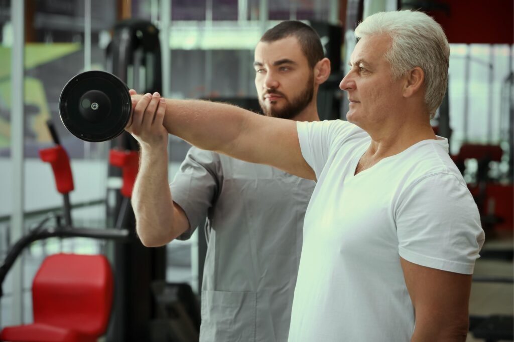 Effective Weight Training Routines For Men Over 60: Boost Your Strength And Well-being 2 Rehabilitation concept. Mature man doing exercise